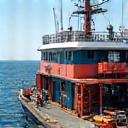 A fishing vessel deck being outfitted with new gear.